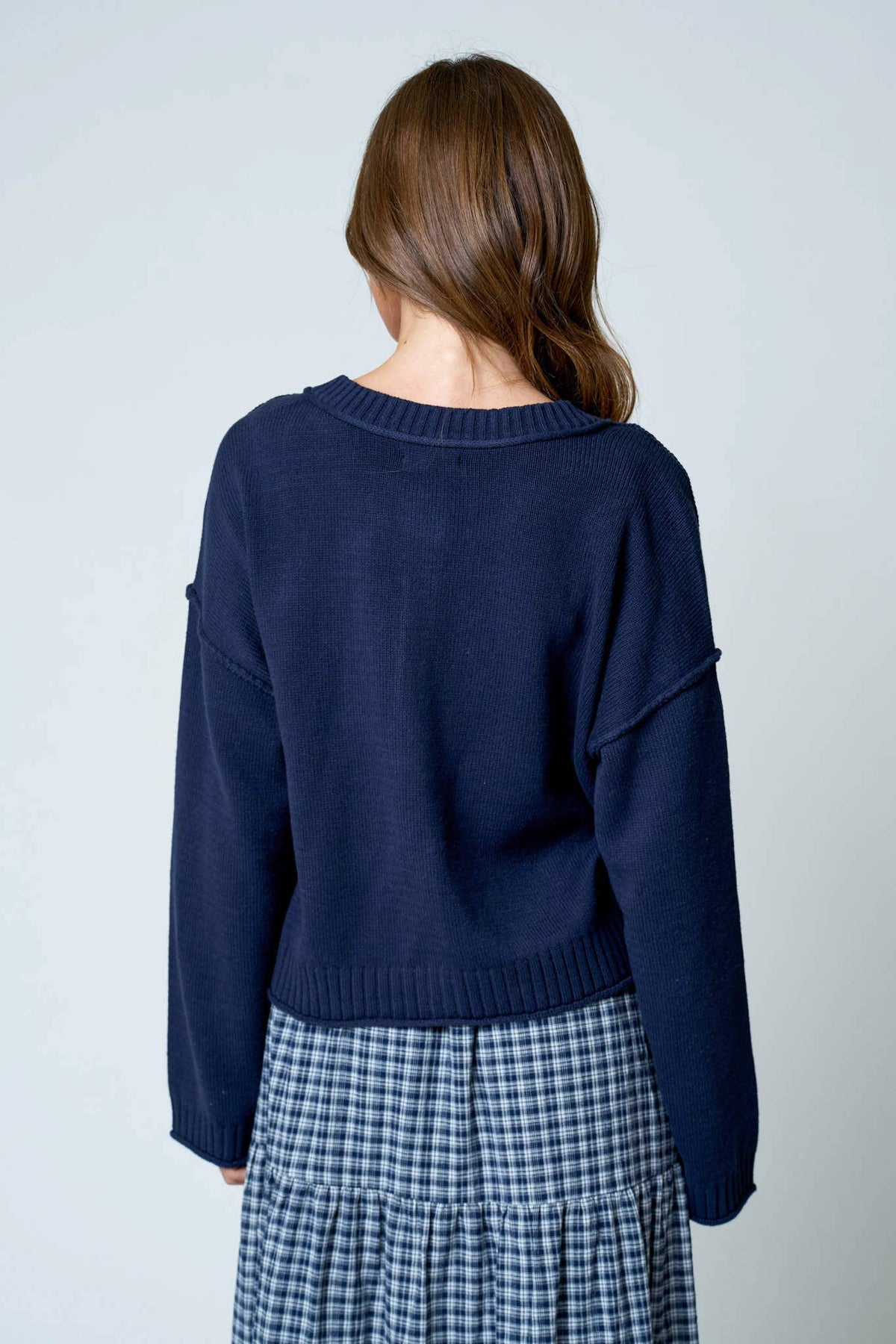 RAW EDGE EXPOSED SEAM BUTTON DOWN KNIT CARDIGAN