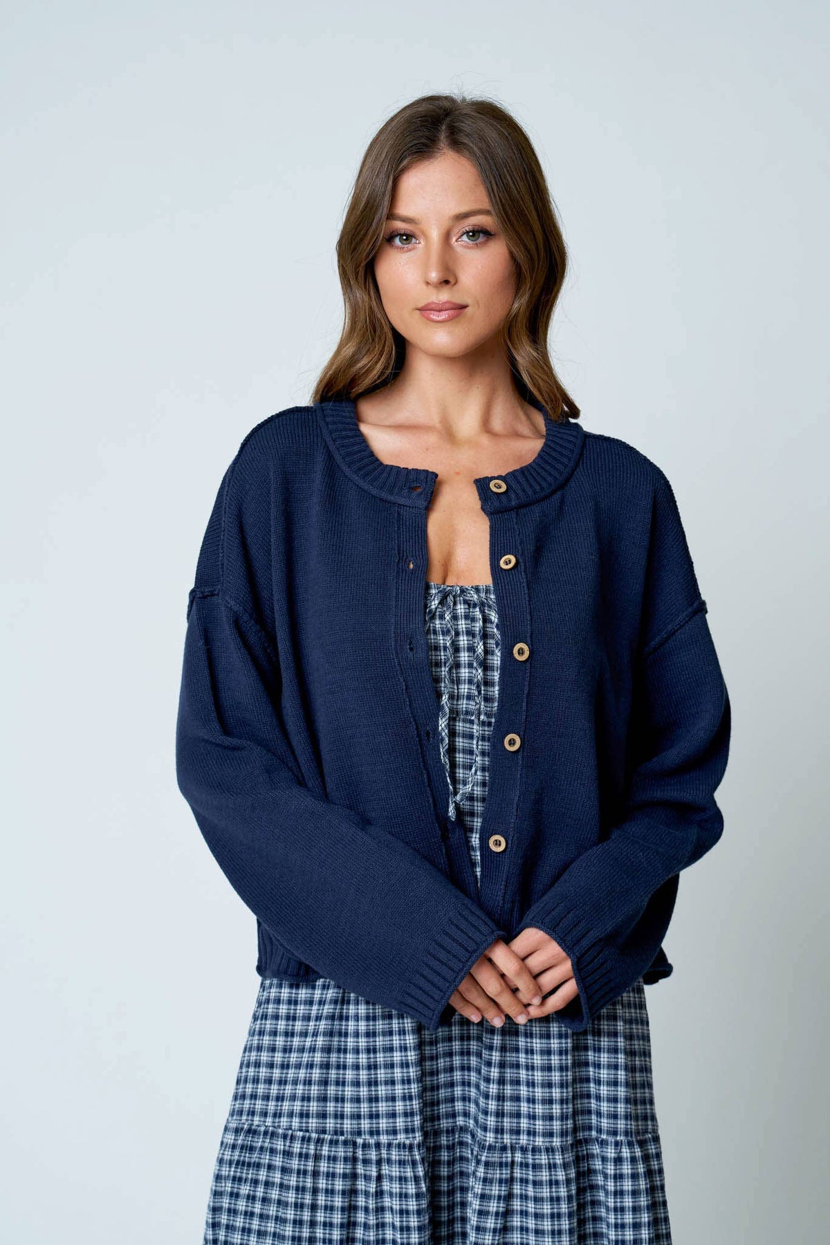 RAW EDGE EXPOSED SEAM BUTTON DOWN KNIT CARDIGAN