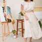 EMBROIDERED FLORAL RUFFLE
WAIST MIDI SKIRT